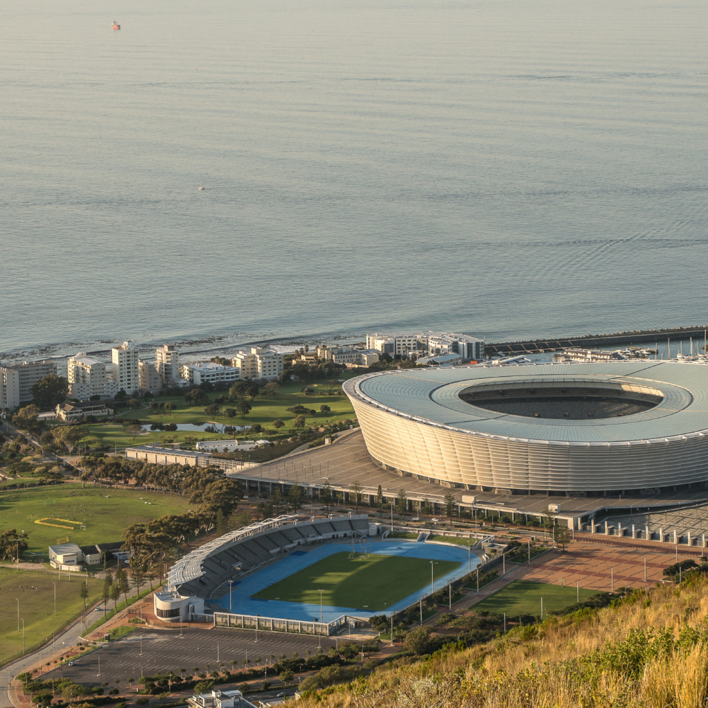 Aerial 3D Rendering of coastal stadium architecture by Fadi Studio